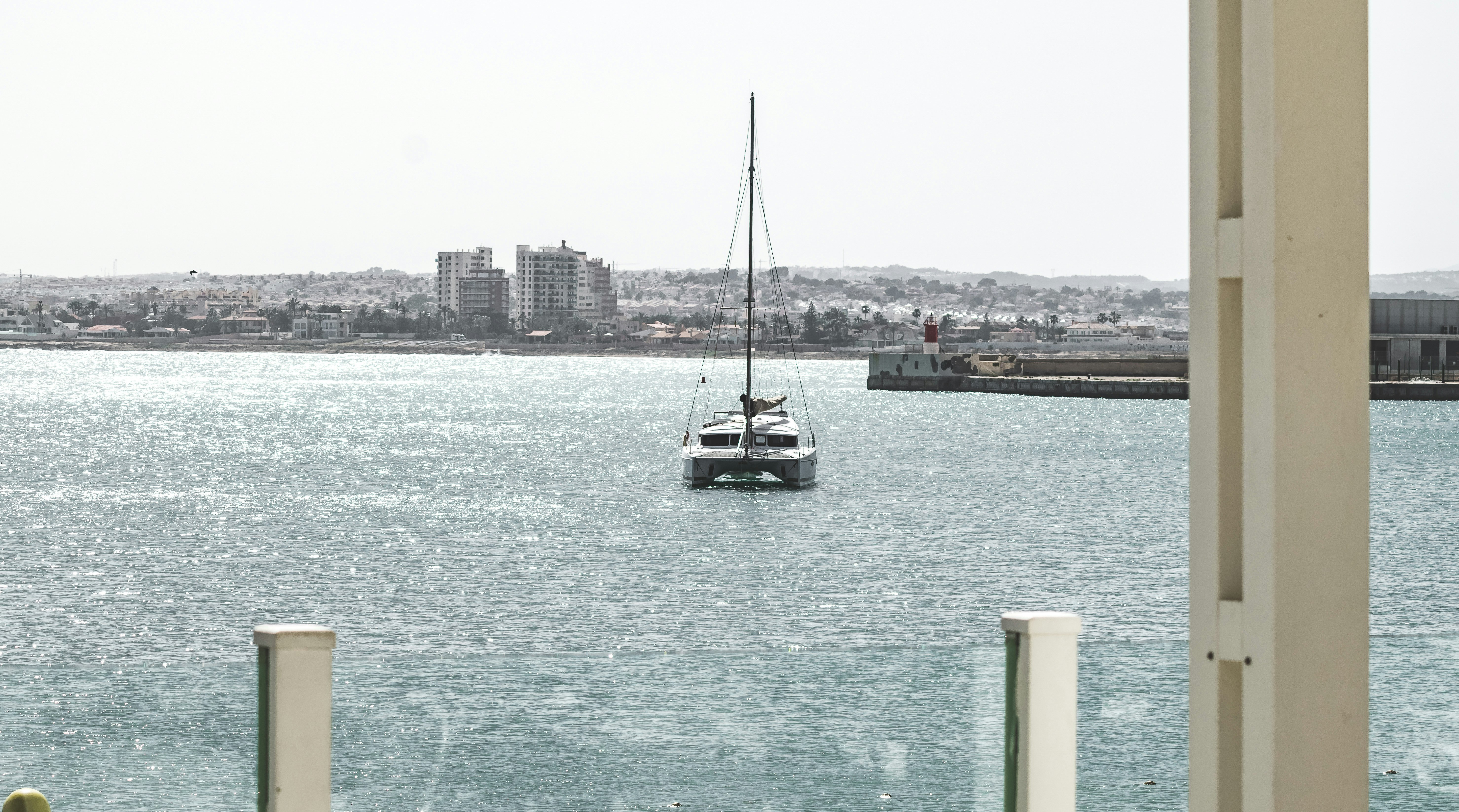 white and black boat on sea during daytime